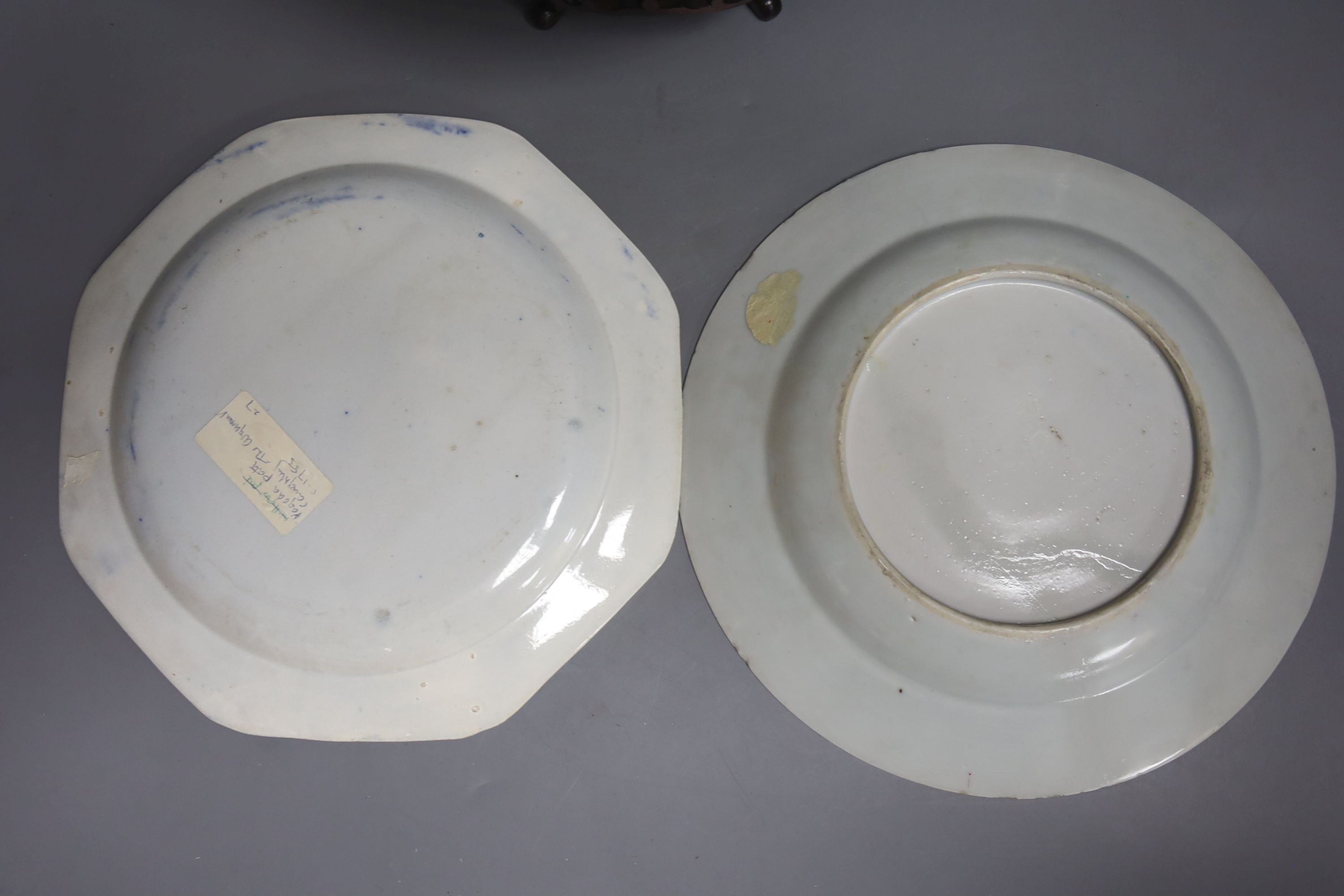 A Chinese export armorial soup plate, a large 18th century Chinese export porcelain footed punch bowl on stand, A Chinese blue and white plates and a pearlware plate